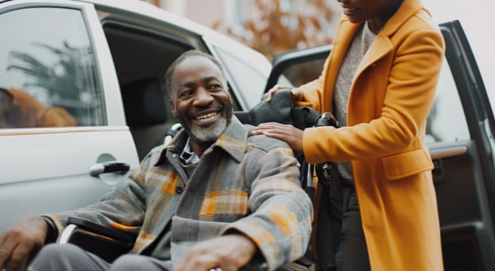 Caregiver gently holding an older adult's hand